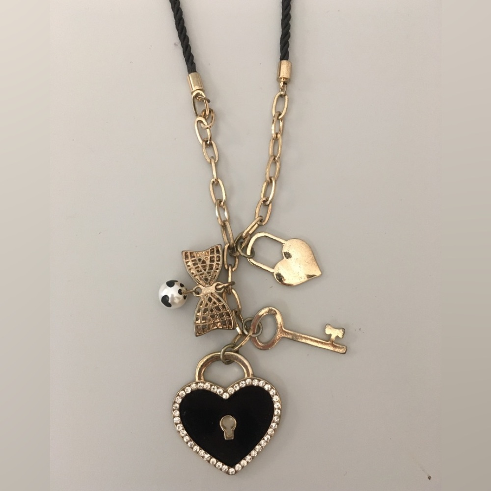 Necklace black and gold with charms 19”